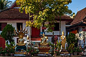 Luang Prabang, Laos - Wat Mai, Buddha statues inside the temple precinct. 